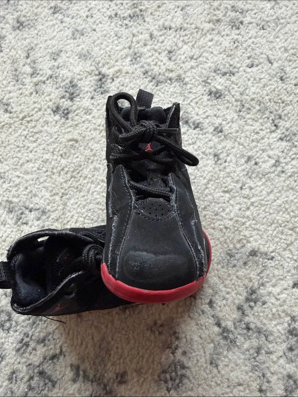 Jordan Kids size 7C shoes. Shows signs of wear.